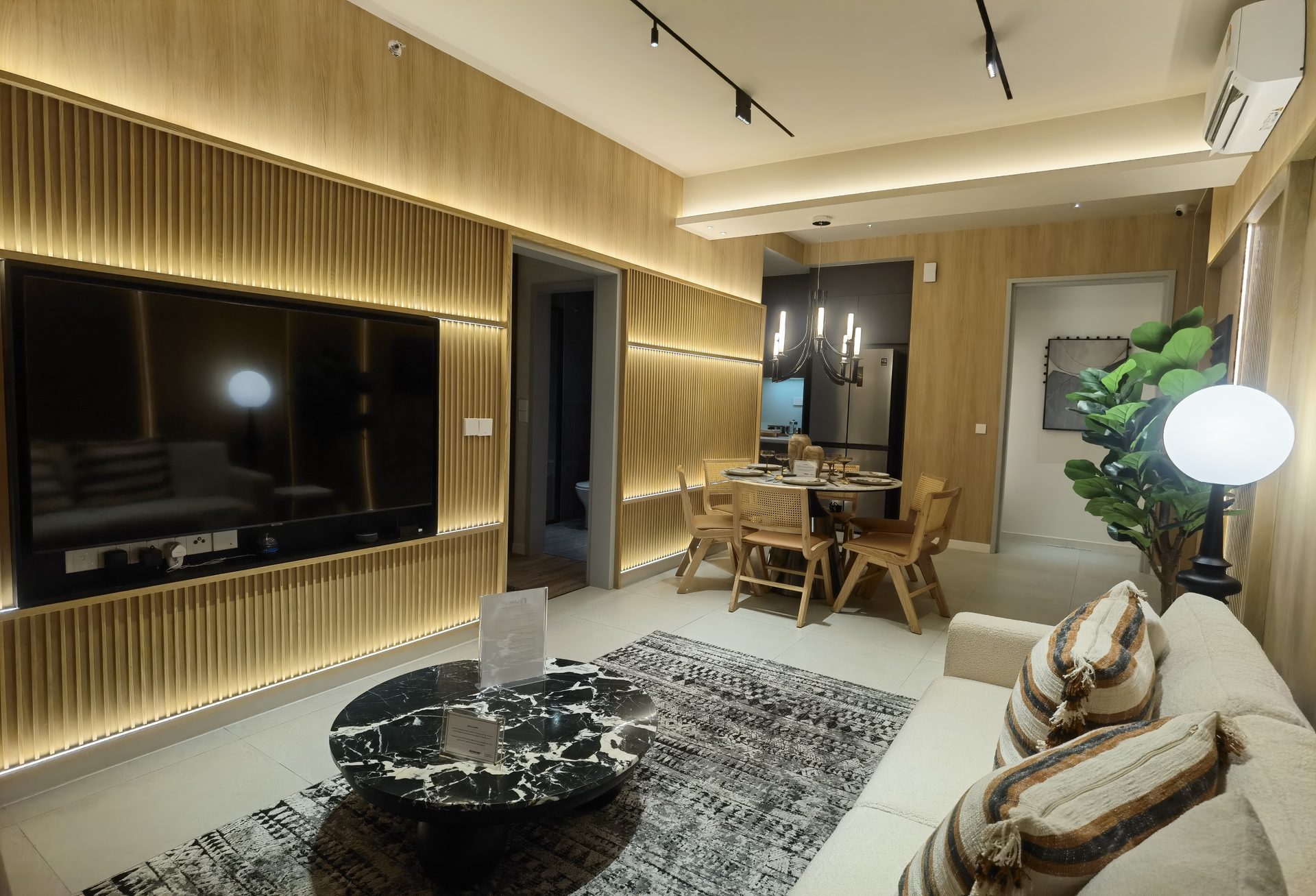 Aricia Residences show unit — living room TV feature wall, actual photo